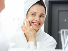 Load image into Gallery viewer, Girl applying Basix Cream to her face